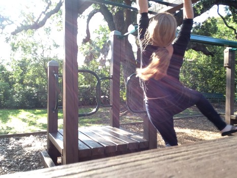 Using the monkey bars as practice. 